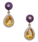 A pair of citrine and amethyst earrings, each amethyst bead surmount inlaid with a...