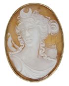 A shell cameo brooch, carved to depict Diana, Goddess of Hunting, in a plain polished...