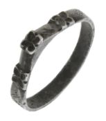 An early Medieval silver ring, circa 12th/13th century, the stirrup ring with quatrefoil...