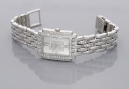 Patek Philippe. A lady's white gold and diamond-set rectangular bracelet watch, Ref....