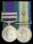 Pair: Sergeant C. G. Garwood, 45 Commando Royal Marines, a Landing Craft specialist who...