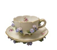 A MEISSEN PORCELAIN CUP AND SAUCER MID 19TH CENTURY lobed form with scalloped gilt edges, finely