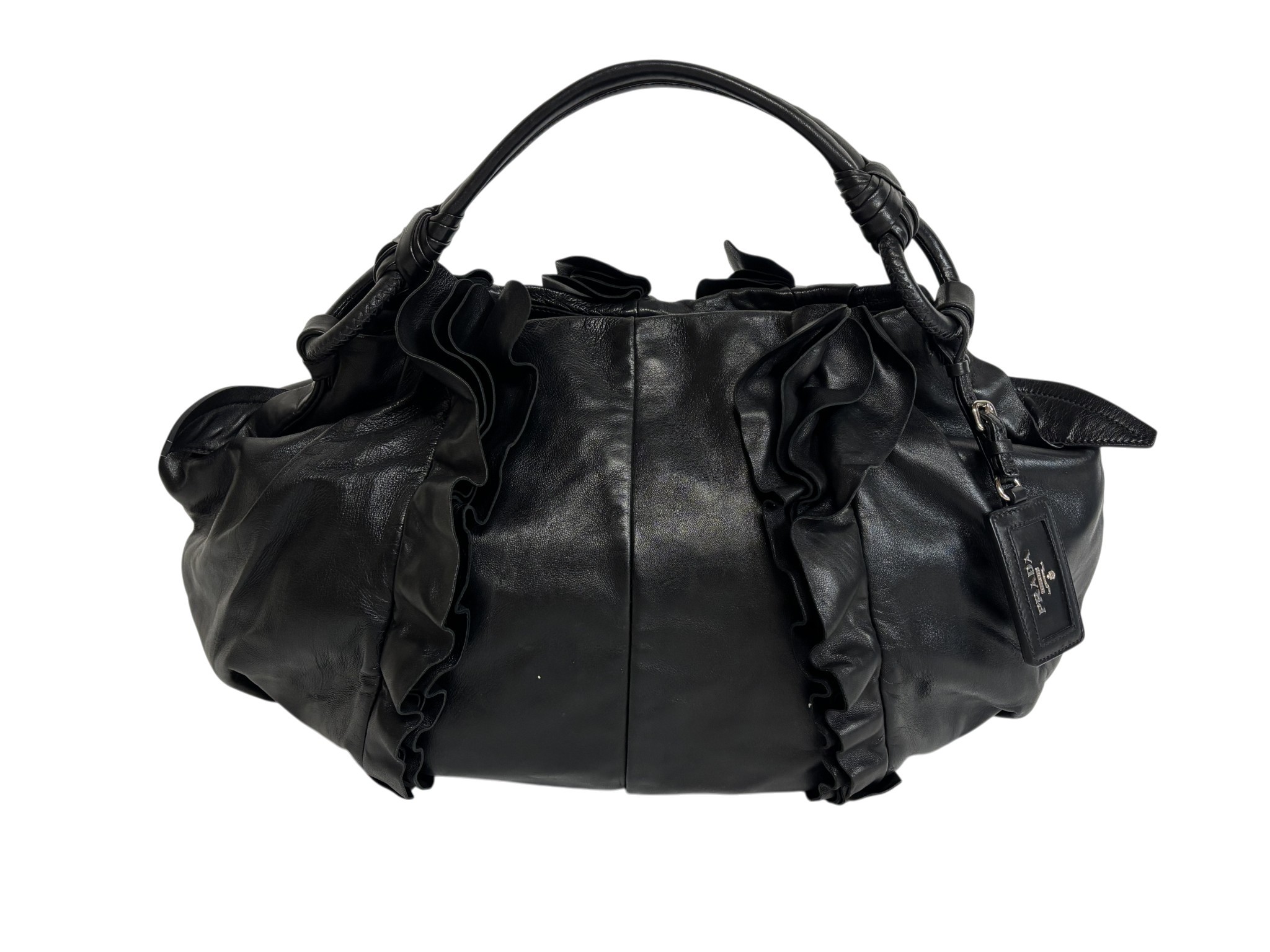 A PRADA NAPPA LEATHER RUFFLE BAG with Prada leather swing label, warranty card with product code