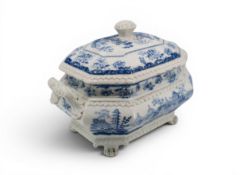 A MINTON 'CHINESE MARINE' BLUE AND WHITE TUREEN of elongated octagonal form and raised upon paw