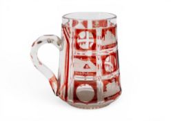 A BOHEMIAN RUBY FLASH SPA TANKARD, 19th century, cut with scenes of buildings and places. 13.75 cms
