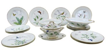 A LIMOGES PART DINNER SERVICE 19TH CENTURY painted with butterflies among flowering grasses, herbs