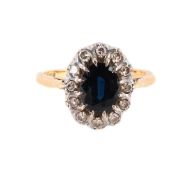 A SAPPHIRE AND DIAMOND CLUSTER RING