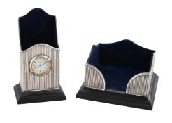 A SILVER MOUNTED DESK CLOCK/PEN HOLDER AND NOTEPAD HOLDER