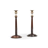A PAIR OF GEORGE III MAHOGANY CANDLESTICKS, IN SCOTTISH STYLE, 19TH CENTURY