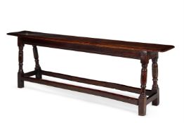 AN OAK LONG STOOL OR FORM ENGLISH, MID 17TH CENTURY