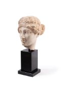 A ROMAN MARBLE HEAD OF A WOMAN WEARING A FILLET