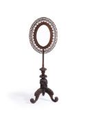 A CARVED BOMBAY BLACKWOOD ADJUSTABLE MIRROR, ANGLO-INDIAN, MID-19TH CENTURY