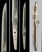 Ω A tanto with skull horimono [carving], Heisei period