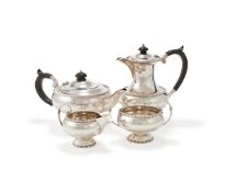 A SILVER CIRCULAR FOUR PIECE TEA SET