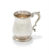 A GEORGE III SILVER BALUSTER TANKARD