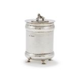 A SILVER HAMMERED JAR AND COVER
