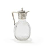 A VICTORIAN SILVER MOUNTED CLARET JUG