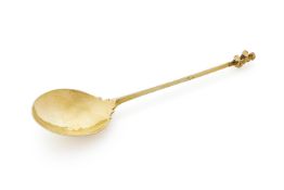 A CONTINENTAL SILVER GILT SPOON