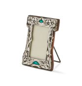 AN EDWARDIAN SILVER MOUNTED AND ENAMEL FRAME