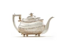 Y A GEORGE III SILVER LOBED OBLONG BALUSTER TEA POT