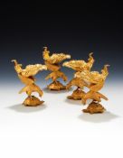 A MATCHED SET OF FOUR GEORGE III SILVER GILT SALTS