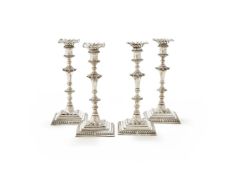 A SET OF FOUR GEORGE III SILVER CANDLESTICKS