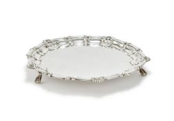A SILVER SHAPED CIRCULAR SALVER