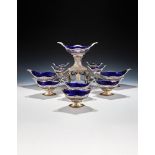 A VICTORIAN SILVER EPERGNE AND SIX DESSERT BASKETS