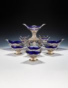 A VICTORIAN SILVER EPERGNE AND SIX DESSERT BASKETS