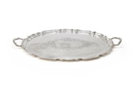 A LARGE SILVER SHAPED OVAL TWIN HANDLED TRAY