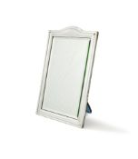 AN EDWARDIAN SILVER MOUNTED EASEL BACKED MIRROR