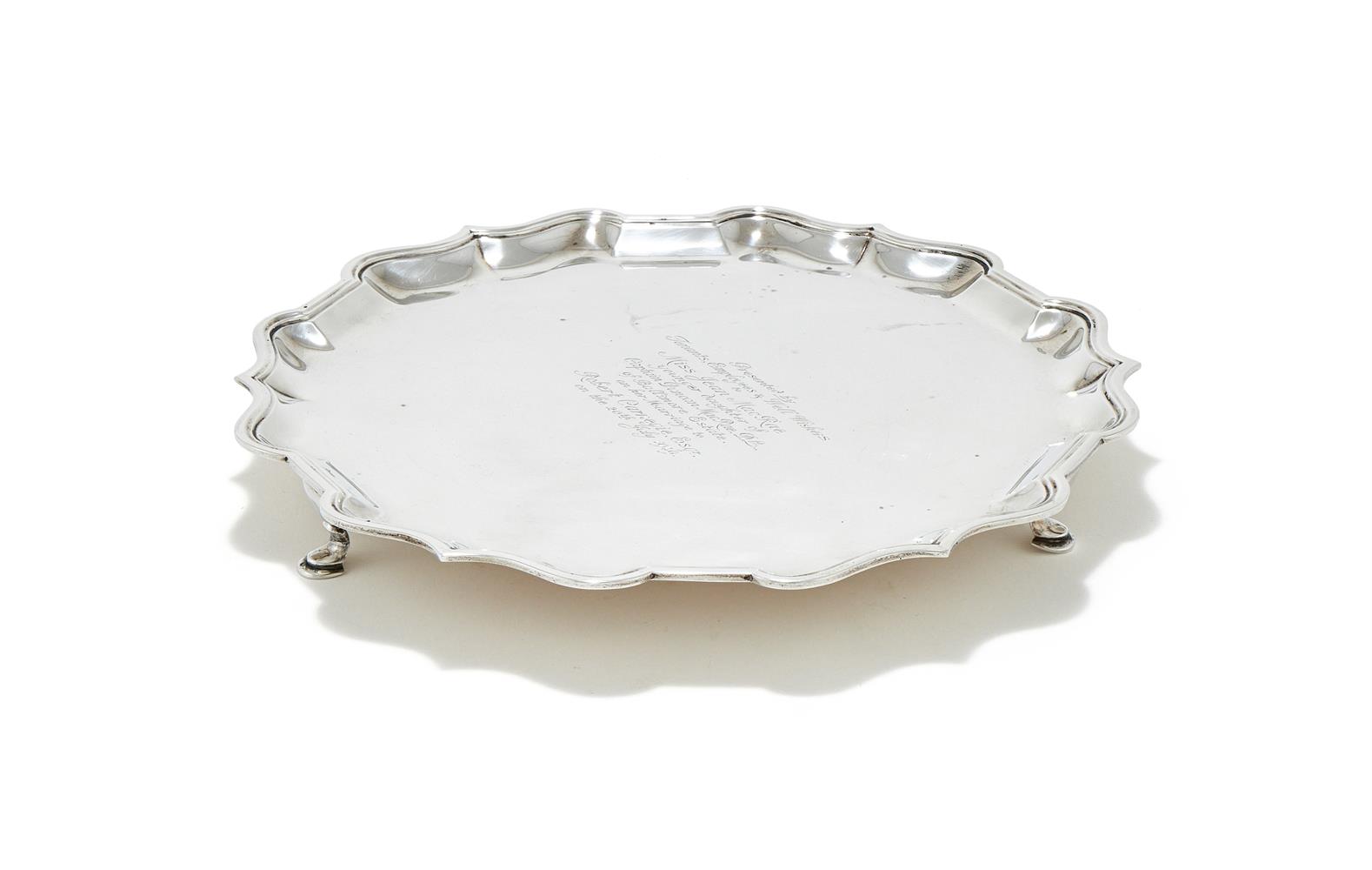 A SILVER SHAPED CIRCULAR SALVER