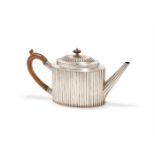 A VICTORIAN SILVER LOBED OVAL TEA POT