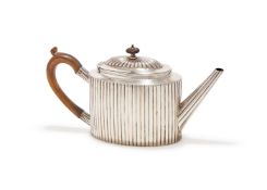 A VICTORIAN SILVER LOBED OVAL TEA POT