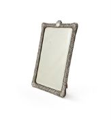 A VICTORIAN SILVER MOUNTED DRESSING TABLE MIRROR