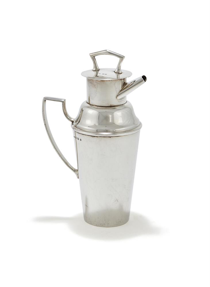 A SILVER COCKTAIL SHAKER