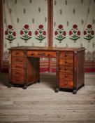 Y A REGENCY ROSEWOOD AND GILT METAL MOUNTED KNEEHOLE DESK, AFTER DESIGNS BY THOMAS HOPE, CIRCA 1815