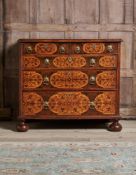 A FINE CHARLES II OLIVEWOOD, WALNUT, FRUITWOOD OYSTER VENEERED AND MARQUETRY CHEST OF DRAWERS