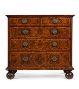 A WILLIAM & MARY OLIVEWOOD OYSTER VENEERED CHEST OF DRAWERS, CIRCA 1690