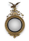 A REGENCY GILTWOOD AND COMPOSITION CONVEX MIRROR, BY JEREMIAH & WILLIAM FREEMAN, CIRCA 1815