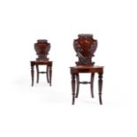 A PAIR OF GEORGE IV CARVED MAHOGANY HALL CHAIRS, IN THE MANNER OF GILLOWS, CIRCA 1830