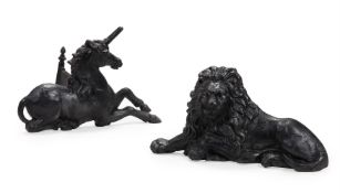 A LARGE PAIR OF CAST IRON ARMORIAL SUPPORTER FIREPLACE STANDS OR BOOT SCRAPES 20TH CENTURY Depict