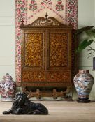 AN INDIAN BLACK AND GILT LACQUER CABINET ON STAND FROM BAREILLY, EARLY 19TH CENTURY