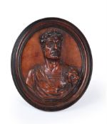AN ITALIAN CARVED STAINED BOX OR SYCAMORE OVAL TONDO RELIEF PORTRAIT OF JULIUS CAESAR