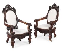 Y A PAIR OF ANGLO INDIAN PADOUK AND UPHOLSTERED ARMCHAIRS, CIRCA 1870