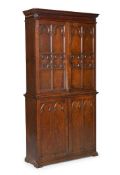 A VICTORIAN CARVED OAK BOOKCASE OR CUPBOARD, IN THE GOTHIC REVIVAL STYLE, SECOND HALF 19TH CENTURY