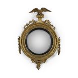 A REGENCY CARVED GILTWOOD CONVEX GIRANDOLE MIRROR, CIRCA 1815