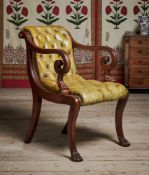 A REGENCY MAHOGANY AND BUTTONED LEATHER UPHOLSTERED LIBRARY ARMCHAIR, CIRCA 1820