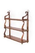 Y A FLIGHT OF REGENCY ROSEWOOD AND BRASS MAHOGANY AND GILT METAL MOUNTED HANGING SHELVES, CIRCA 1820