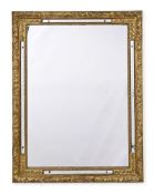 A GILTWOOD AND COMPOSITION MIRROR, IN RÉGENCE STYLE, 19TH CENTURY